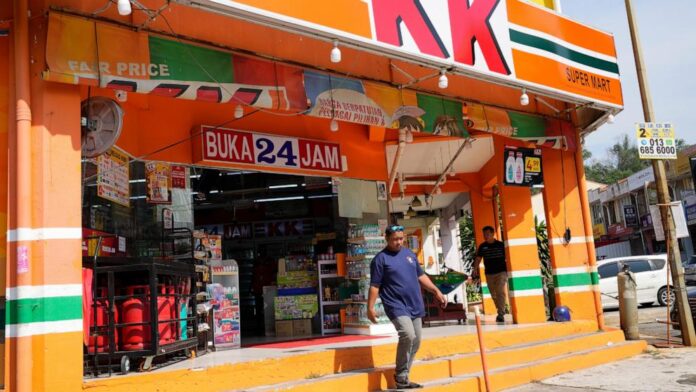 Malaysian convenience store owners charged over 'Allah' socks that angered Muslims